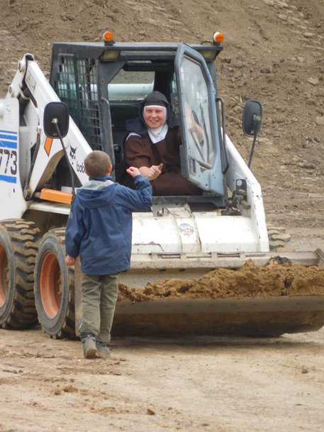 Nuns Learn to Operate Bobcat Loader to Restore New Home